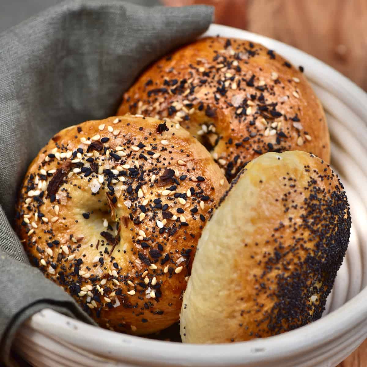 Three homemade bagels in a bowl