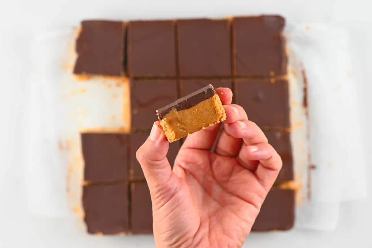 A close up of a square of peanut butter bar