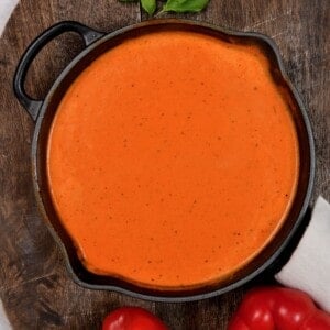 A large pan with roasted red pepper sauce