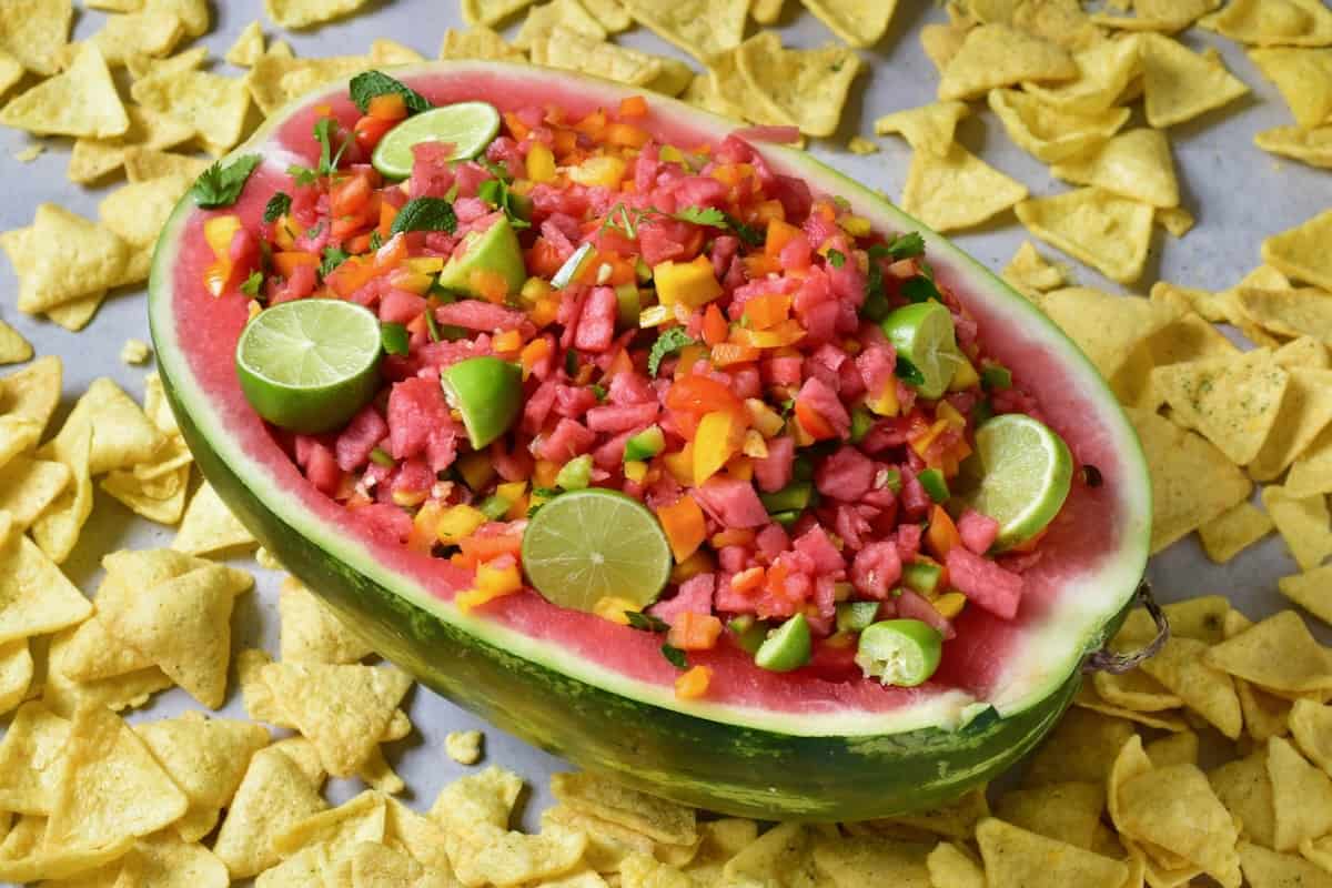 Salsa with watermelon and peppers served in a watermelon bowl