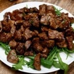 closeup of Garlic Butter Steak Bites on a white plate - 19