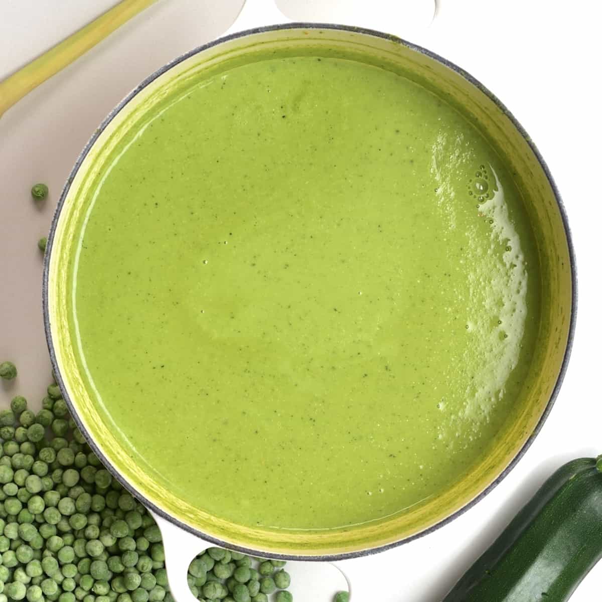 A saucepan wit homemade green pea soup