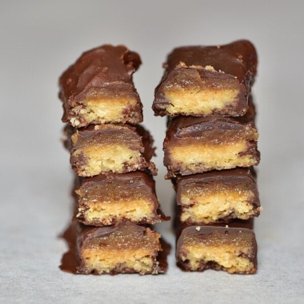 Four homemade Twix bars each cut in two and stacked