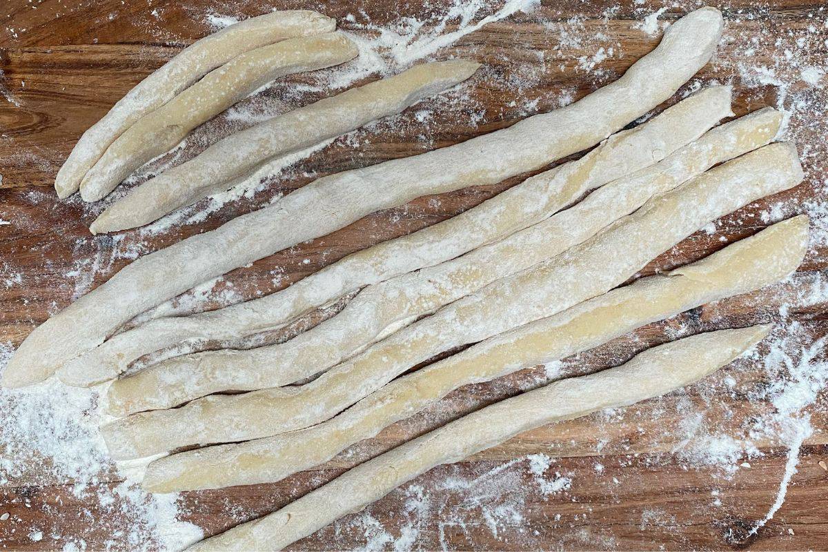Chop the gnocchi dough into long strips.