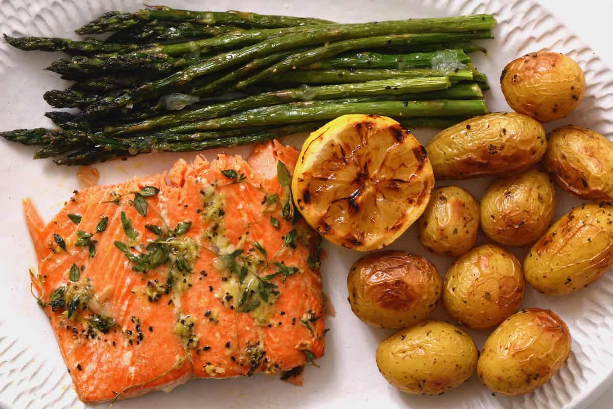 Baked salmon served with potatoes and asparagus