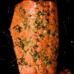 Oven baked salmon topped with lemon zest and thyme