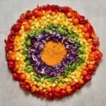 A rainbow veggie pizza with sweet potato crust
