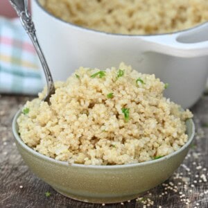 Fluffy quinoa in a bowl topped with parsley