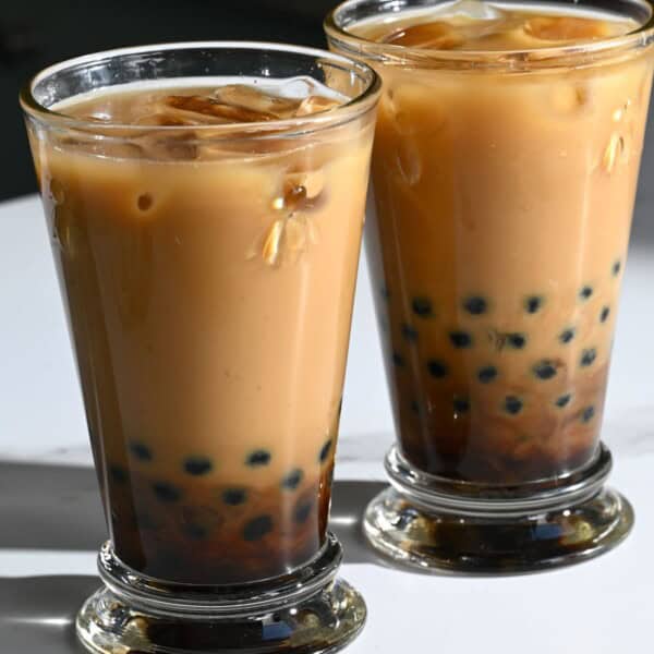 Two glasses with freshly made homemade bubble milk tea.