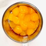 Homemade mango boba pearls in a glass. - 15