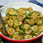 A serving bowl with Korean cucumber salad. - 12