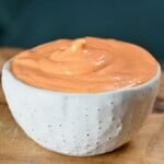 Close-up of thick, creamy Sriracha mayo in a small white bowl. - 7