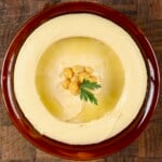 A bowl with homemade hummus. - 16