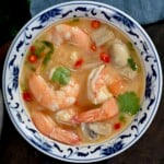 A serving of creamy Tom Yum soup topped with cilantro. - 15