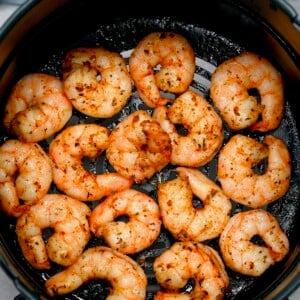 Air fried shrimp still in the air fryer basket.