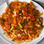 A serving of freshly baked hamburger casserole with melty cheese. - 17