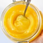 A jar with homemade ghee and a spoon placed inside. - 14