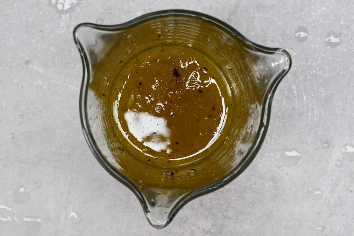 top view photo of salad dressing in a glass cup.