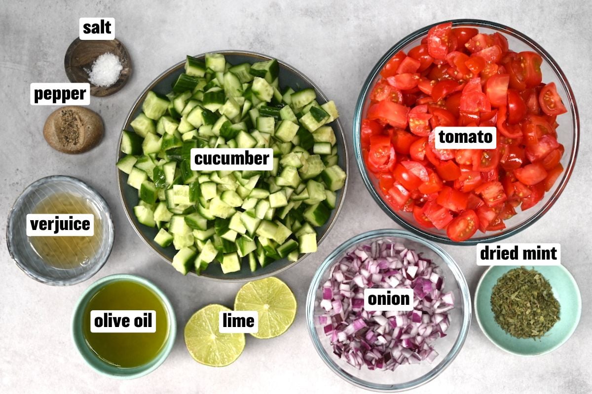 Top view of ingredients for making shirazi salad on grey background. - 7