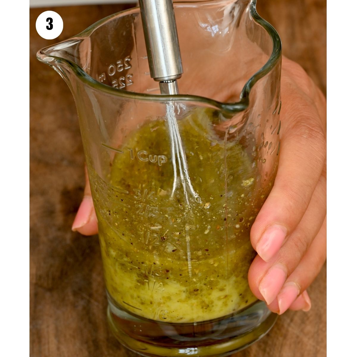 Side view of whisking the dressing for the pasta salad. - 5