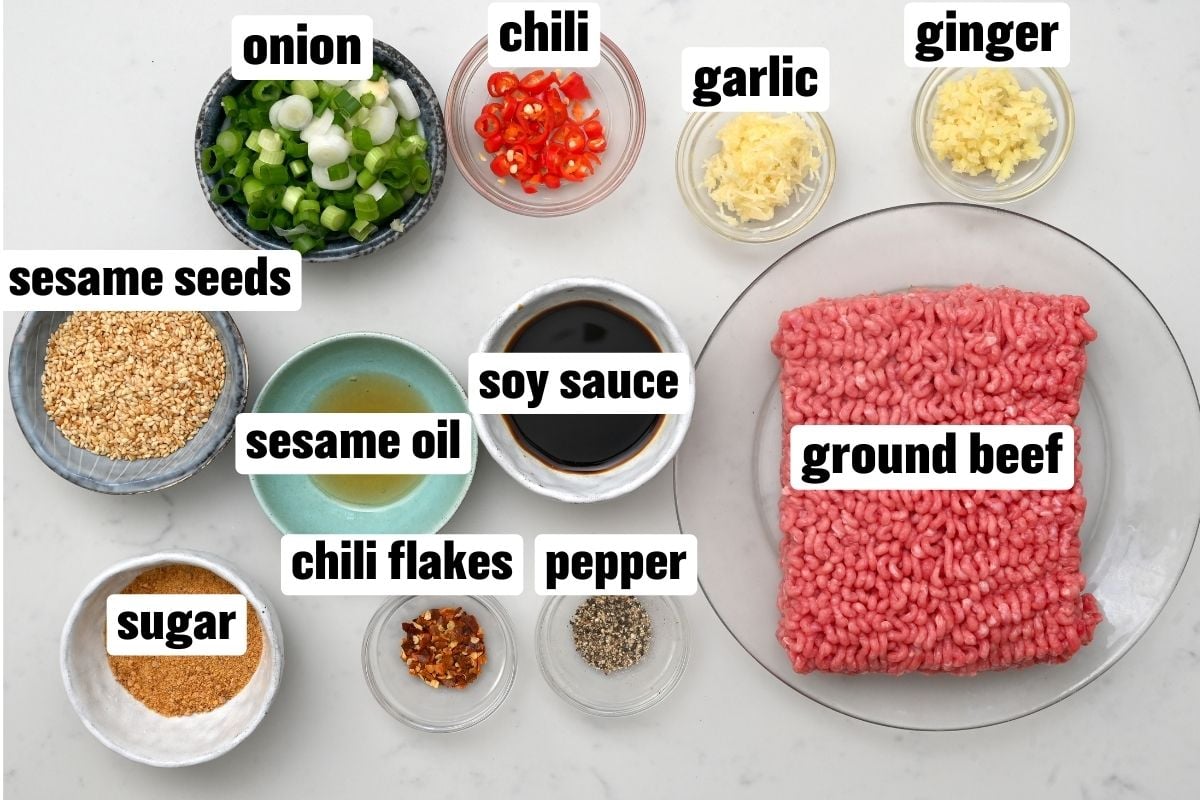 Top view of the ingredients for making korean ground beef on white marble. - 3