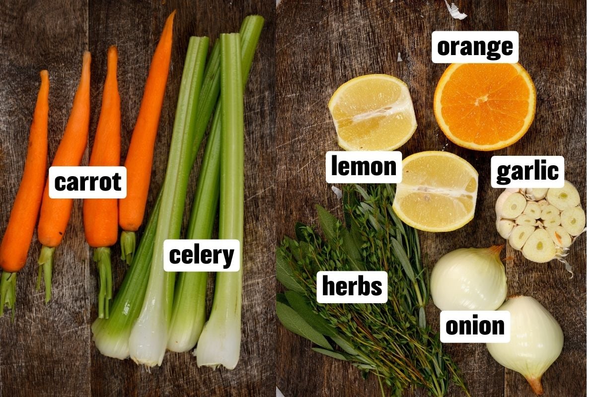 top view of carrots, celery, lemon, orange, garlic, onion and herbs on a wooden board - 5