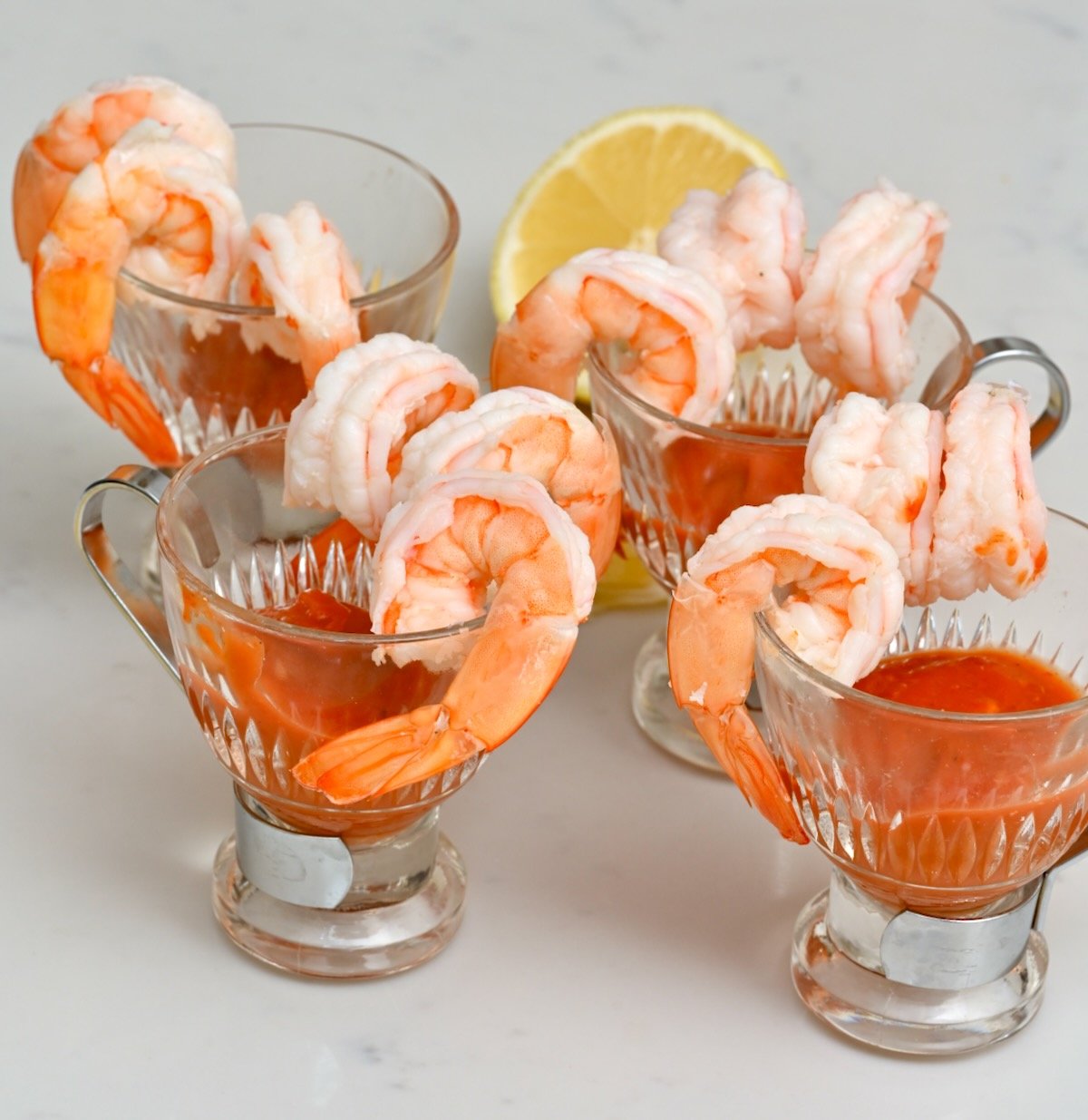 shrimp cocktail being served in small glass bowls - 2
