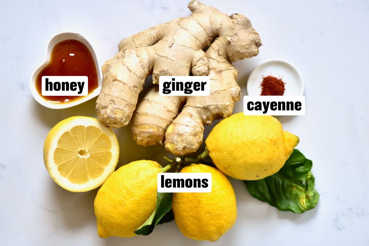 A photo of the ingredients for simple ginger lemon shots.