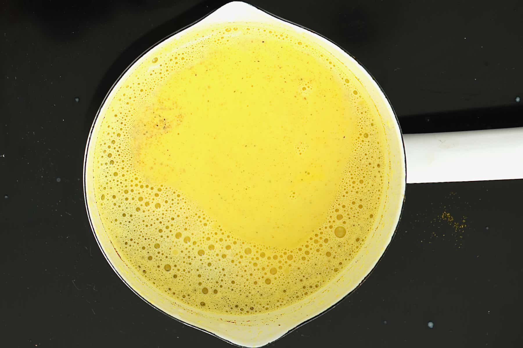 A pot with freshly made turmeric milk. - 11
