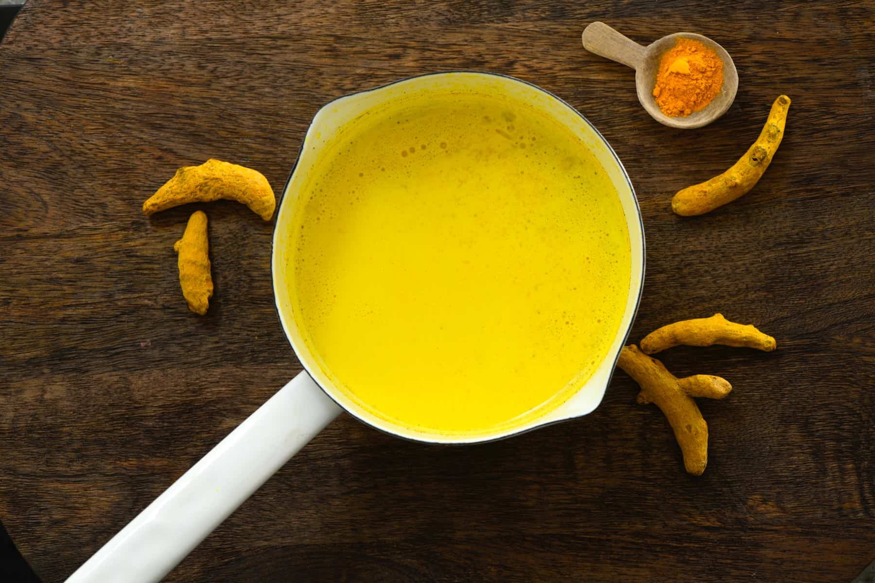 A pot with freshly made golden milk. - 8