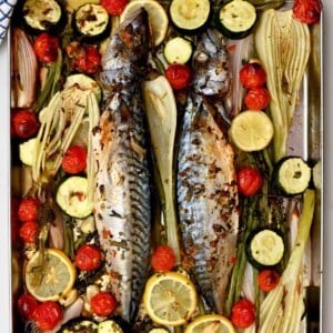Oven-baked mackerel roasted with fennel, zucchini, cherry tomatoes, and lemon on a sheet pan. - 16