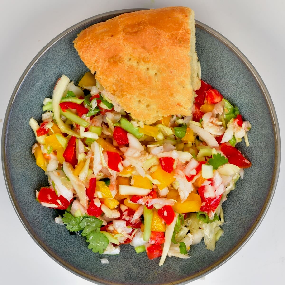 Coconut bake slice served with buljol salad.