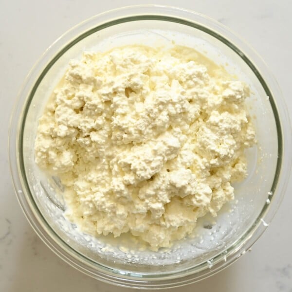 Homemade cottage cheese mixed in a large bowl.