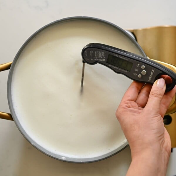 Milk heated to 180 degrees F in a large pan.