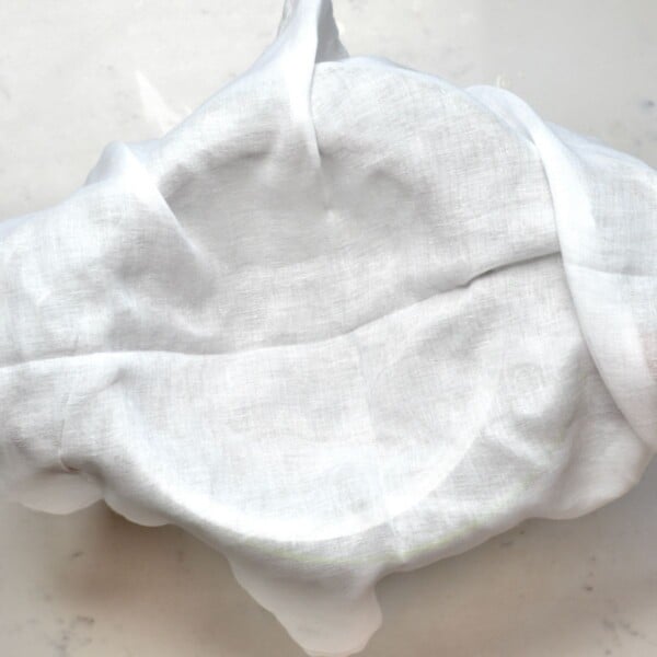 Cheesecloth lined over a strainer.