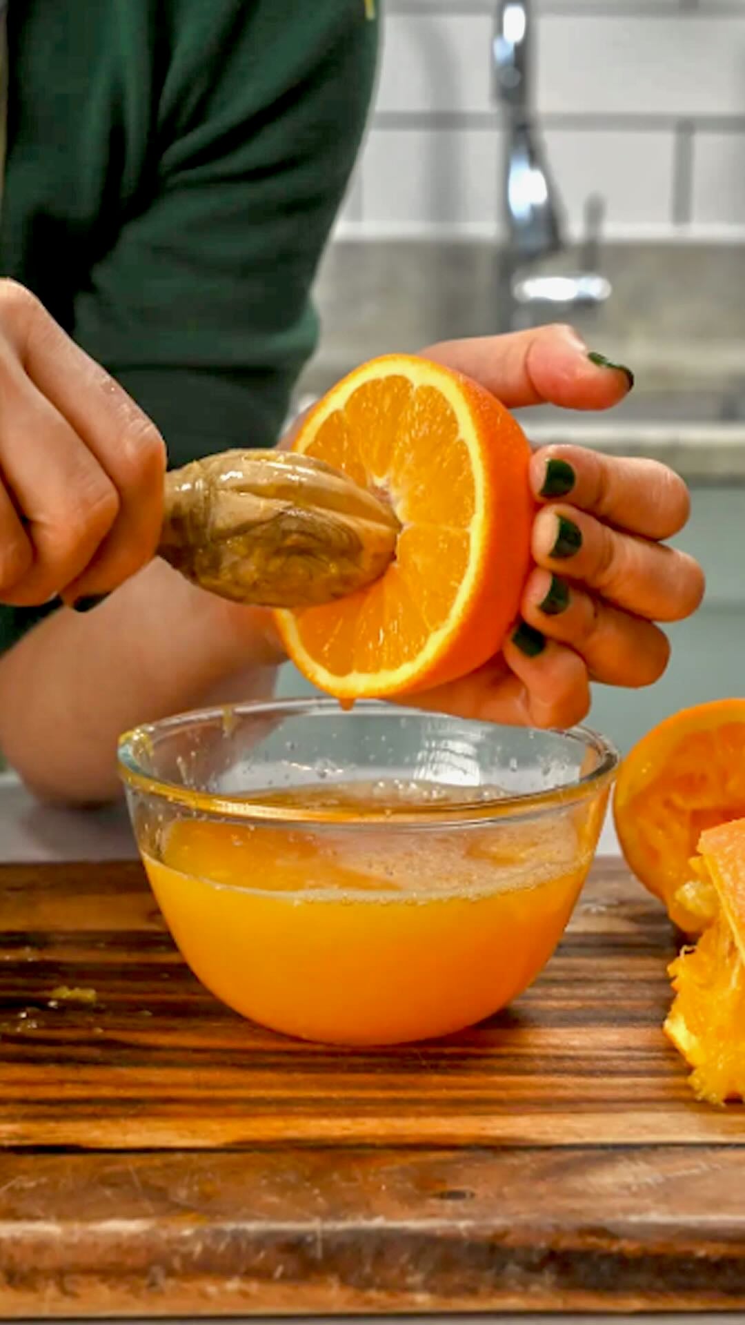 How to Make Orange Juice - Using a wooden reamer to make orange juice. Using a wooden reamer to make orange juice.