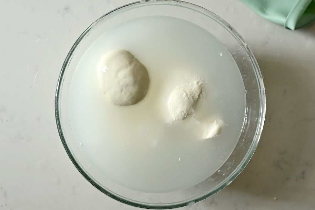Resting mozzarella balls in some water.