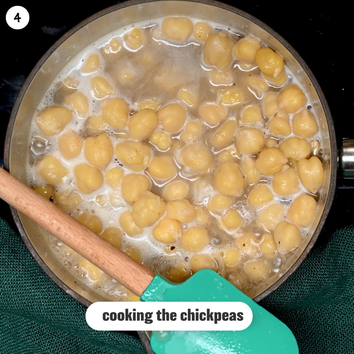 Photo of cooked chickpeas in a saucepan.