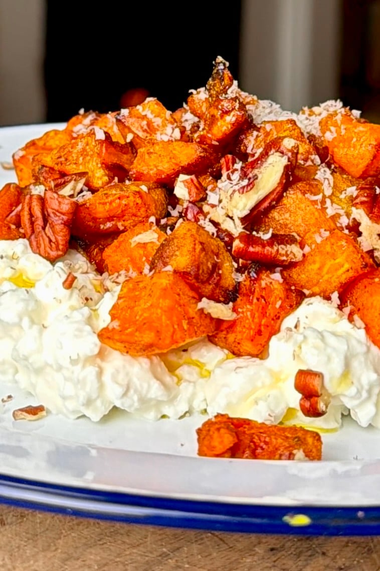 Cottage cheese topped with cinnamon-roasted sweet potato cubes, pecans, and maple.
