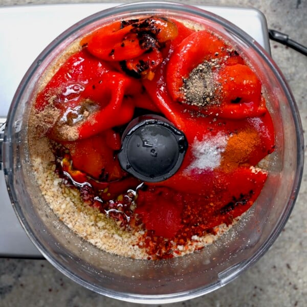 Roasted pepper and spices added to the walnuts in the food processor.