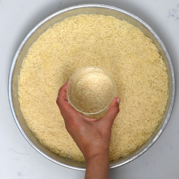 Kataifi spread on a baking pan.