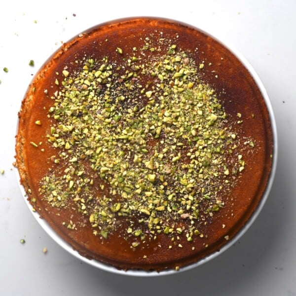 Pistachios spread over freshly baked kunafa.