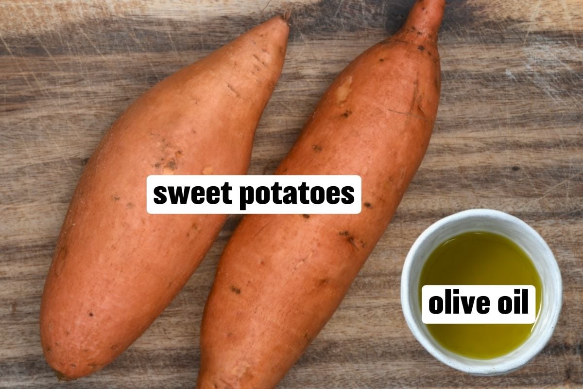 Two sweet potatoes and a little bowl with olive oil.
