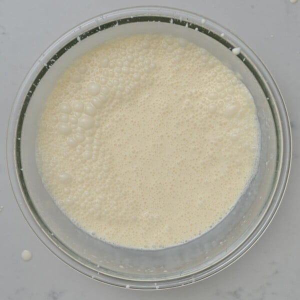 Dairy ingredients whisked in a bowl.