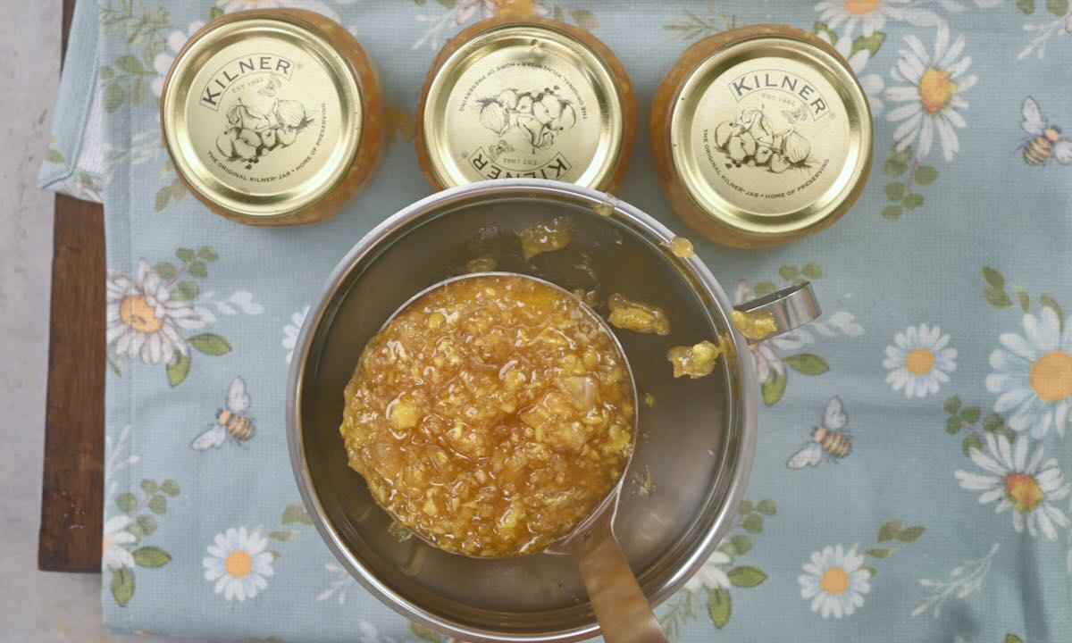 Filling jars with freshly made ginger jam.