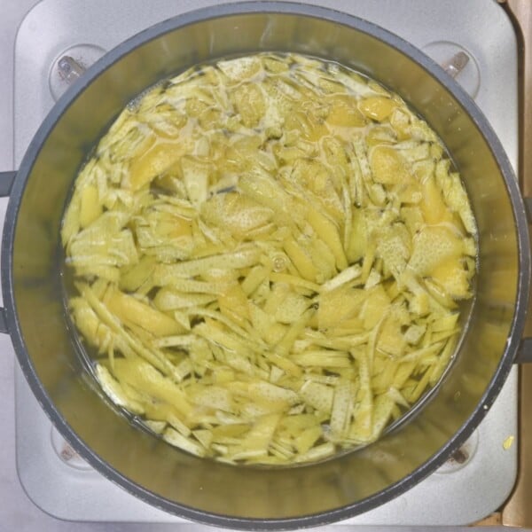 Lemon peel and water in a small saucepan.
