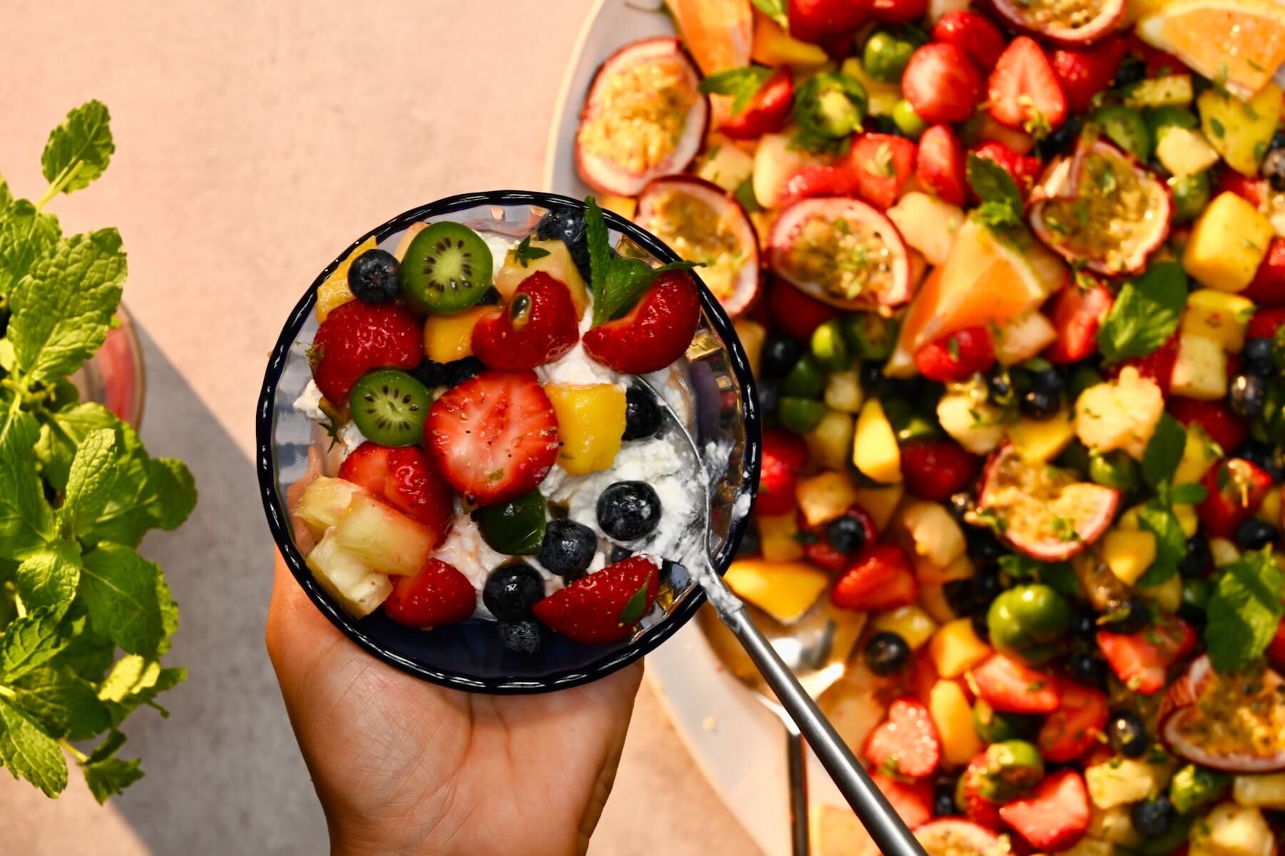 Serving fruit salad with cottage cheese.
